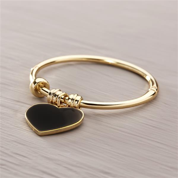 Strength in love. Cuff bracelet with a black heart