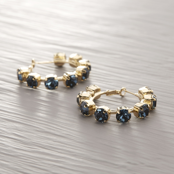 Sensuality. Hoops with deep blue crystals