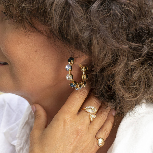 Sensuality. Hoops with deep blue crystals