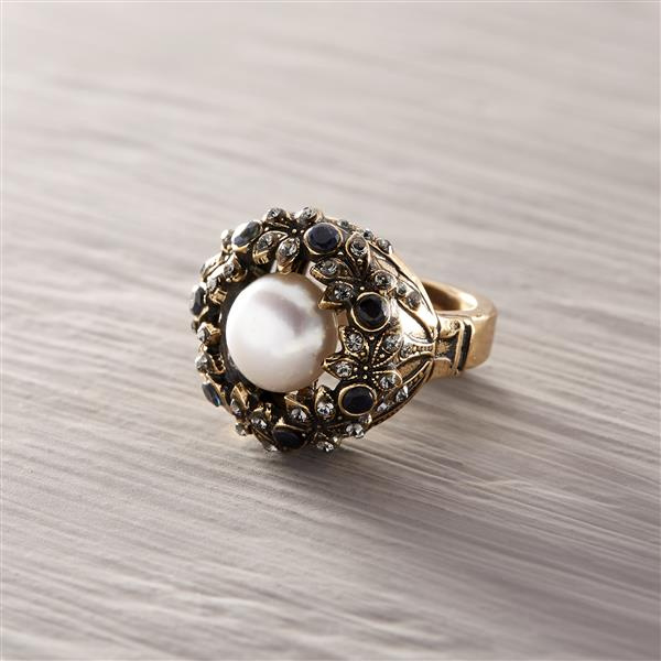 Crazy about them pearls. Statement ring