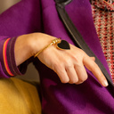 Strength in love. Cuff bracelet with a black heart