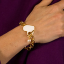 Face of an angel. Chain bracelet with a white heart