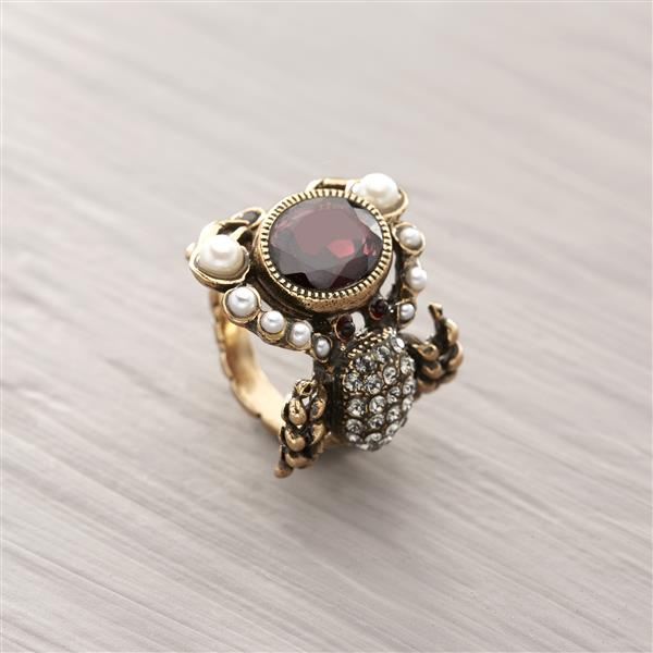 Scorpio's soul. Sculpted ring with garnet, pearls, and crystals