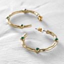 Botswana. Hoop earrings with green crystals