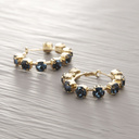 Sensuality. Hoops with deep blue crystals